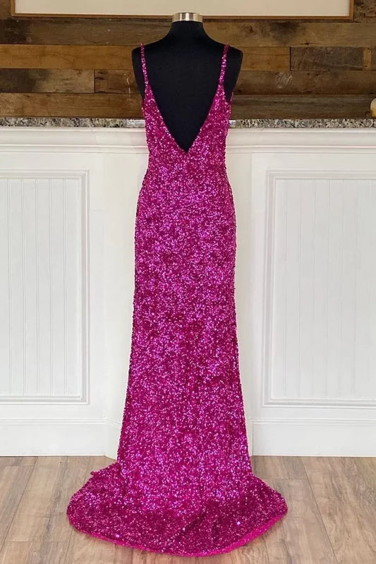 Full view of a model wearing a hot pink sequin mermaid prom dress with a sweetheart neckline and shimmering fabric.