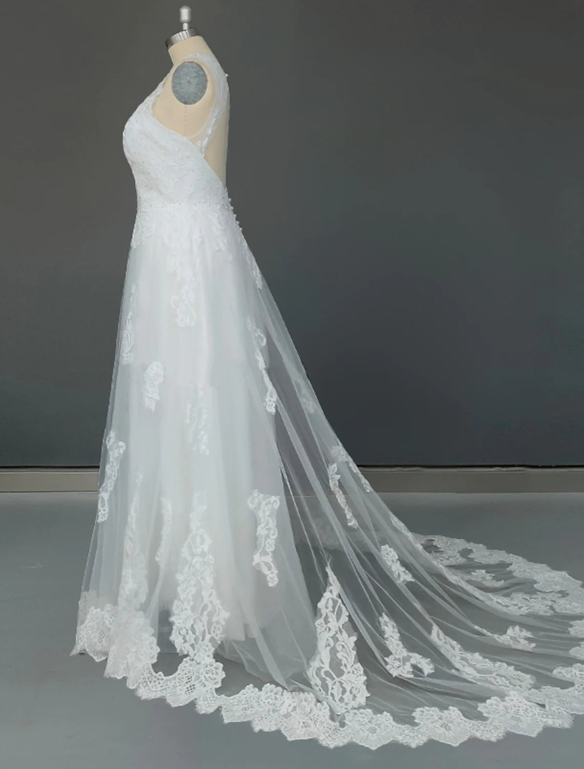 Elegant A-Line tulle wedding gown with appliques and court train.