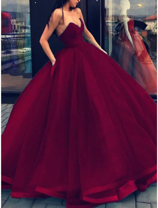 Floor-length formal dress featuring a strapless design.