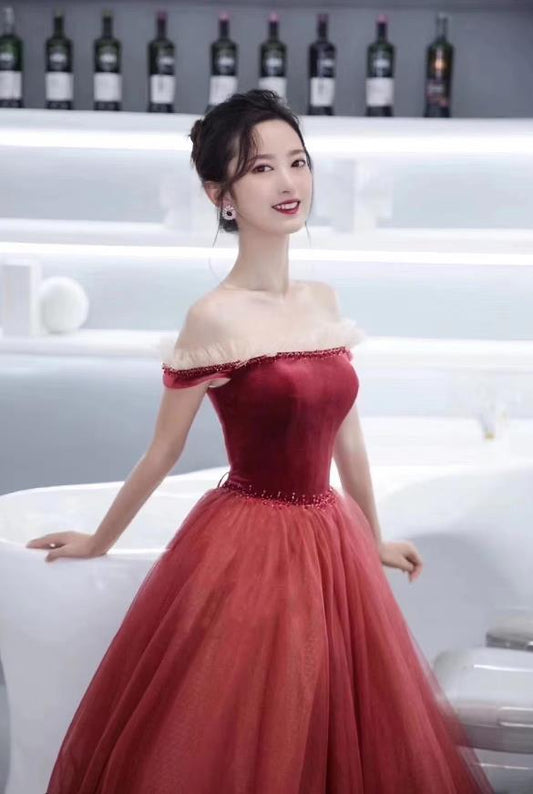 Full view of an elegant off-shoulder short sleeve tulle ball gown with a sweep train.