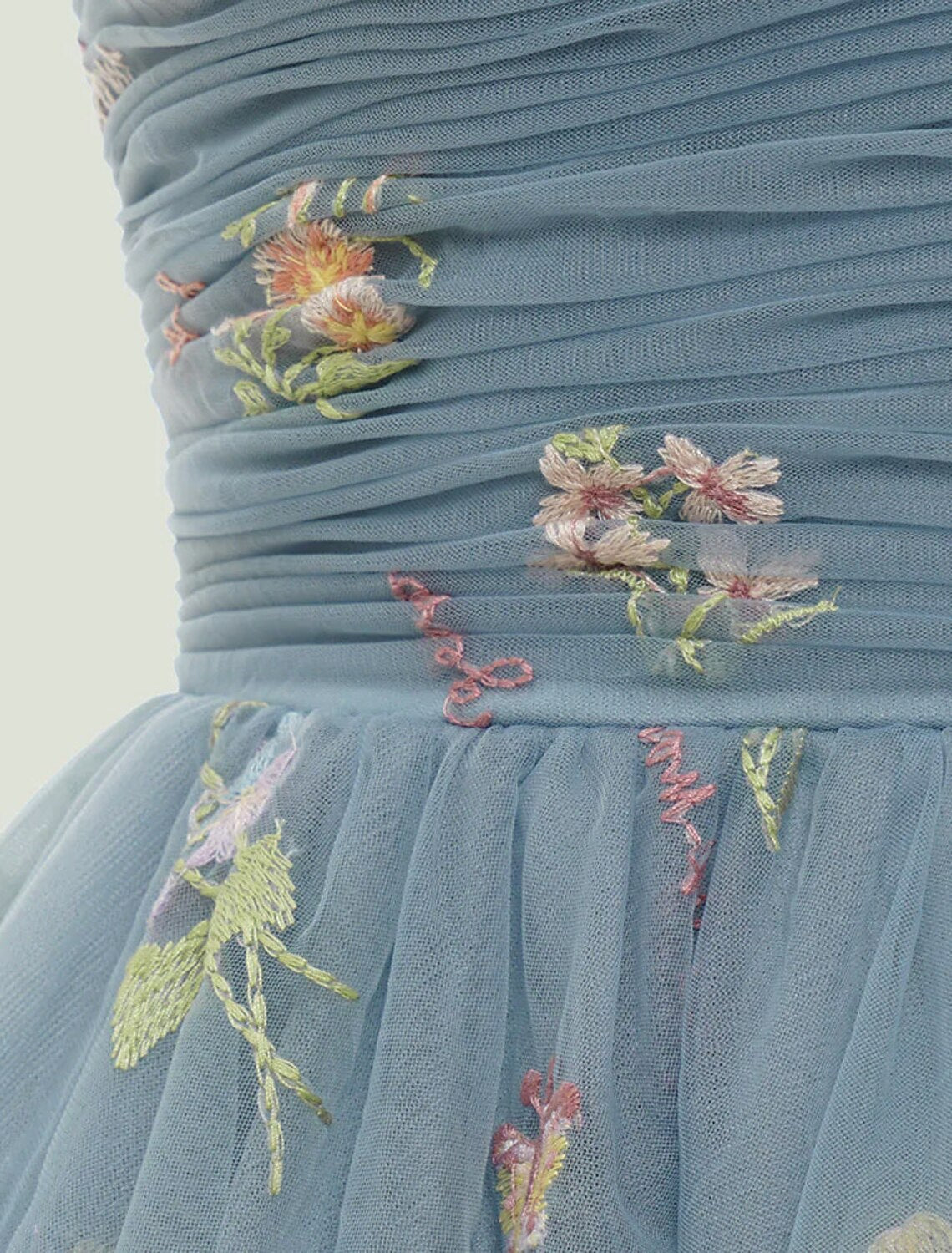 Side profile of the elegant A-line floral embroidered party dress.