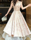 Elegant A-line champagne prom dress with halter bow neckline and jacquard bodice.