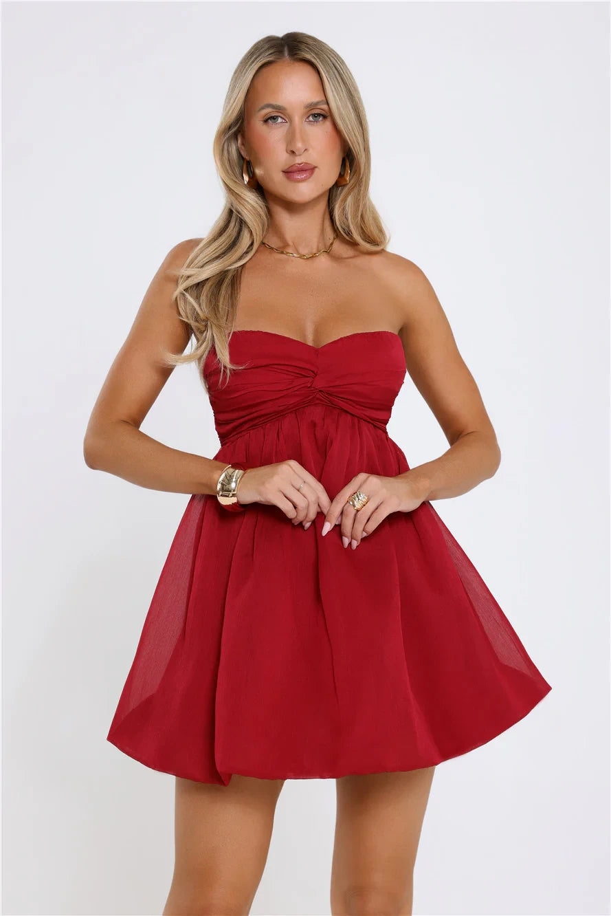Close-up of the sweetheart neckline and bodice of the red mini homecoming dress.