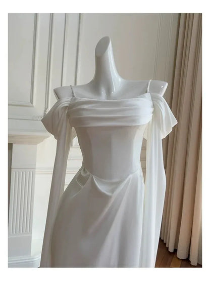 Elegant Mermaid Off-shoulder Long-sleeve Corset-back White Satin Floor-length Prom Dress.
