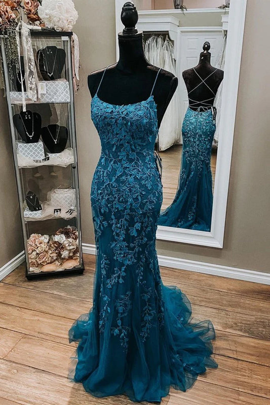 Model wearing an elegant teal-blue mermaid prom dress with scoop neck, spaghetti straps, lace appliqués, and corset back.