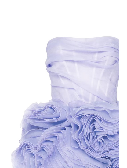 Side view of a short strapless ruched tulle party dress.