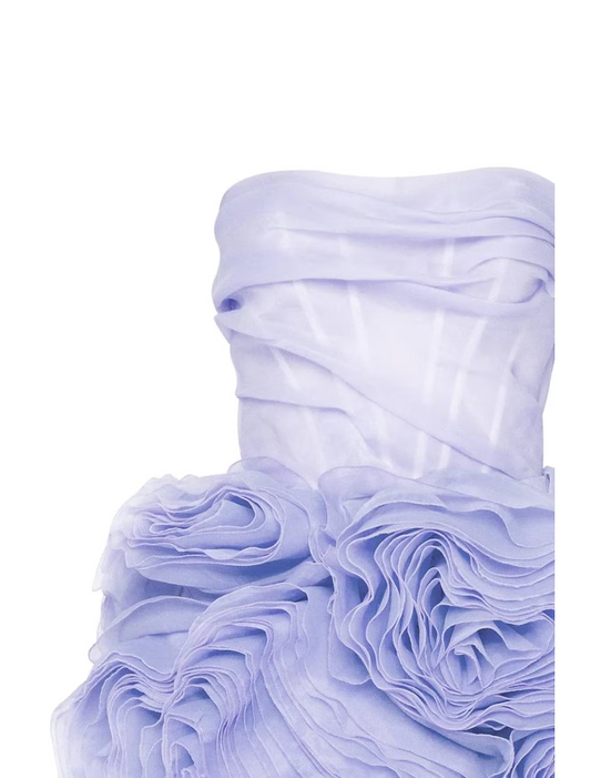 Side view of a short strapless ruched tulle party dress.