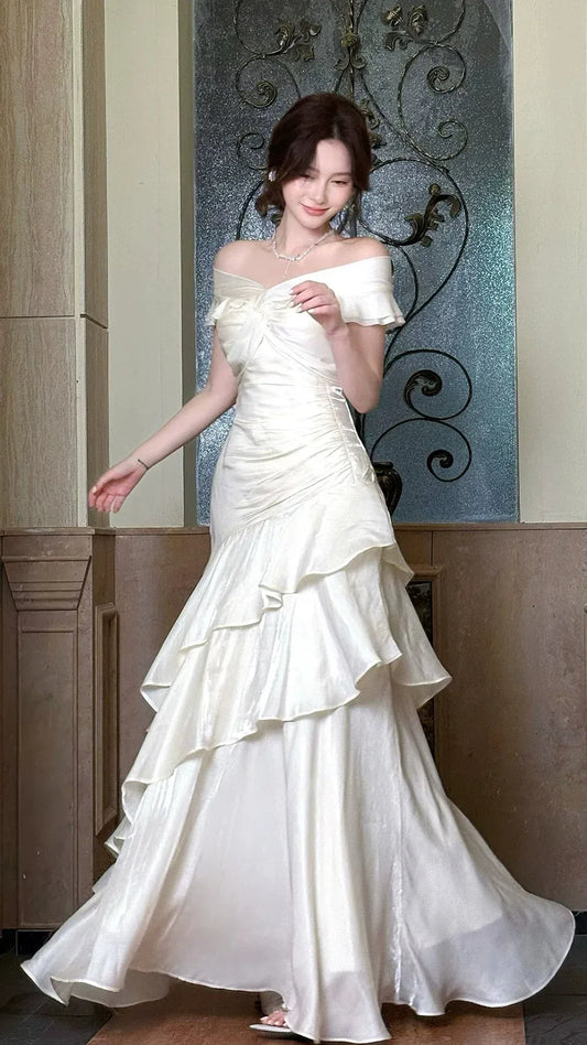 Elegant White Off-Shoulder Ruched Ruffle Satin Mermaid Prom Dress.