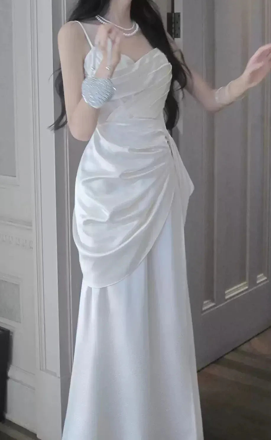 Elegant white satin mermaid prom dress with ruched wrap bodice.