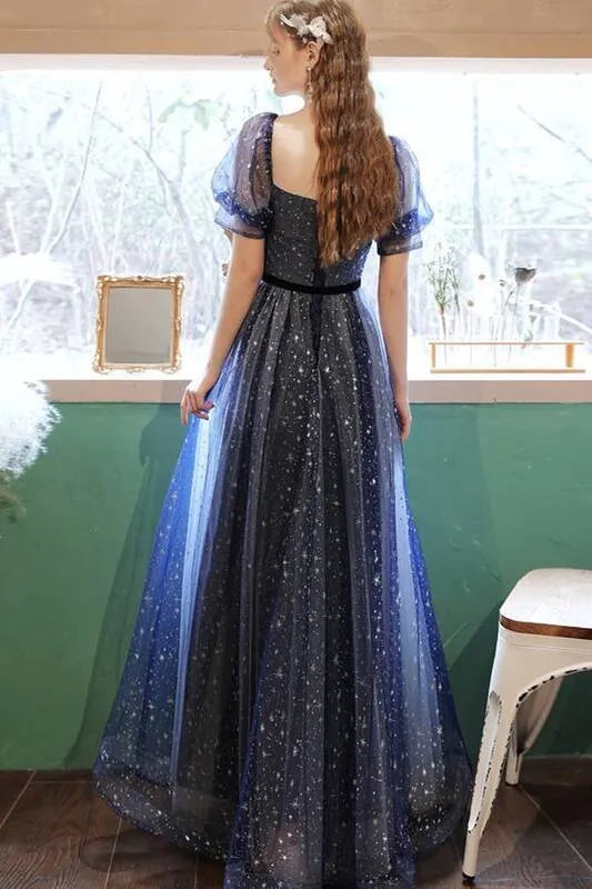 Full view of the blue gradient glitter A-line prom dress with puff sleeves and velvet waist belt.