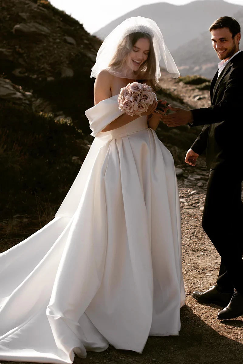 Minimalist Ball Gown Off Shoulder Strapless Bow Back Train Length Wedding Dress