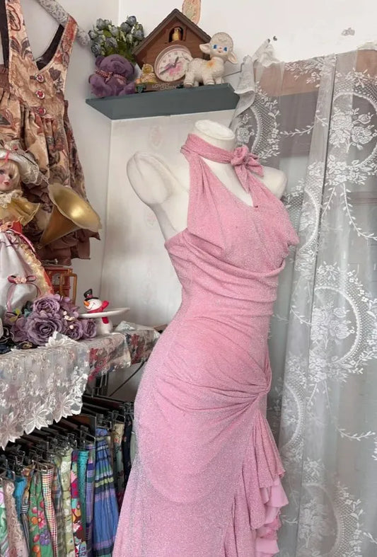 Close-up of the halter neck with bow and glitter fabric on the Sparkling Pink Prom Dress.