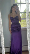 Vibrant purple mermaid prom dress with sweetheart neckline, spaghetti straps, twist-front, and ruched details.