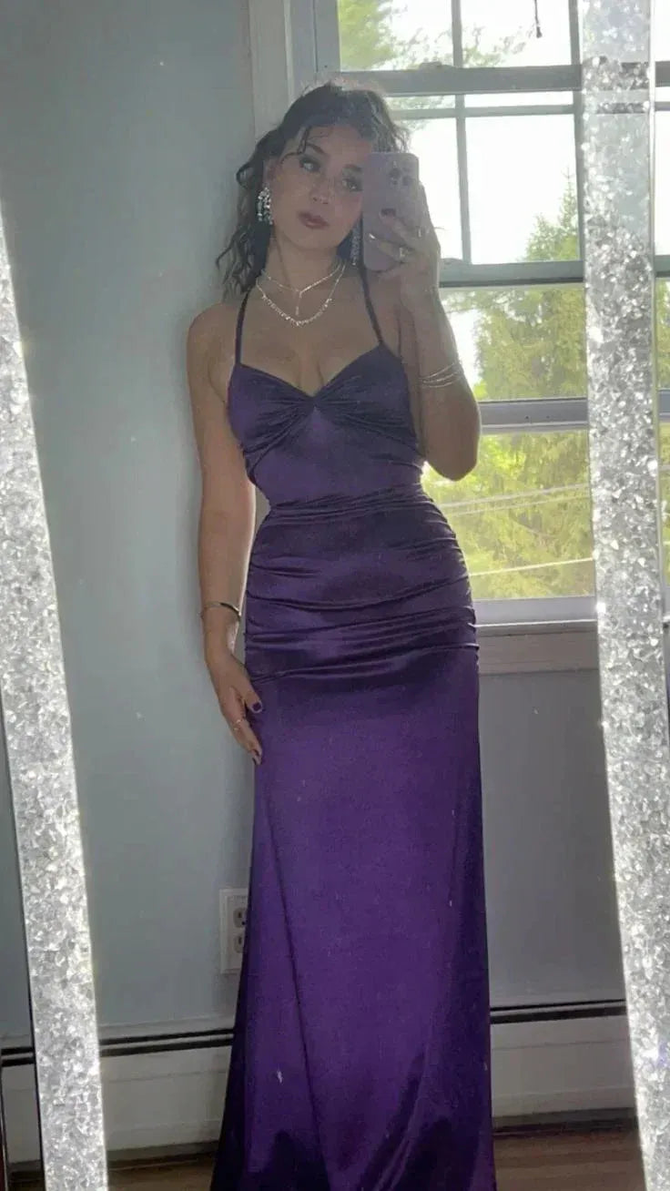 Vibrant purple mermaid prom dress with sweetheart neckline, spaghetti straps, twist-front, and ruched details.
