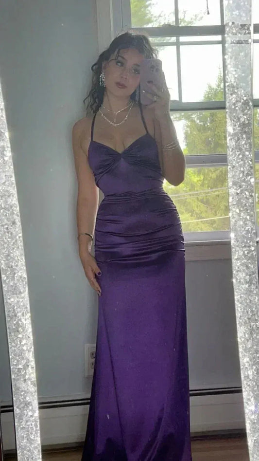 Vibrant purple mermaid prom dress with sweetheart neckline, spaghetti straps, twist-front, and ruched details.