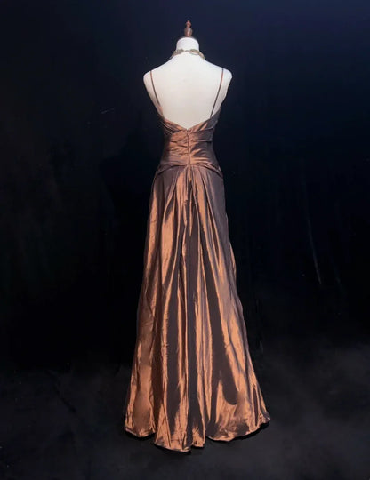 Vintage A-line bronze prom dress, showing crystal floral waist detail.