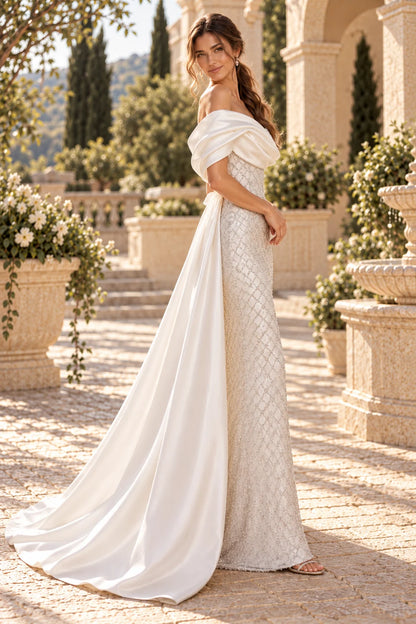 Off shoulder satin draped beaded mermaid gown with detachable overskirt train
