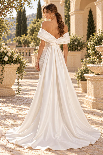 Off shoulder satin draped beaded mermaid gown with detachable overskirt train