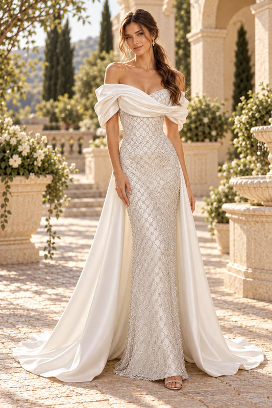 Off shoulder satin draped beaded mermaid gown with detachable overskirt train