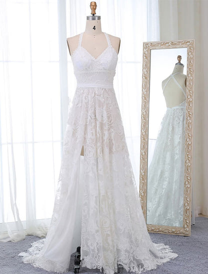 Boho A-Line V-Neck wedding dress with lace appliques and court train, front view.