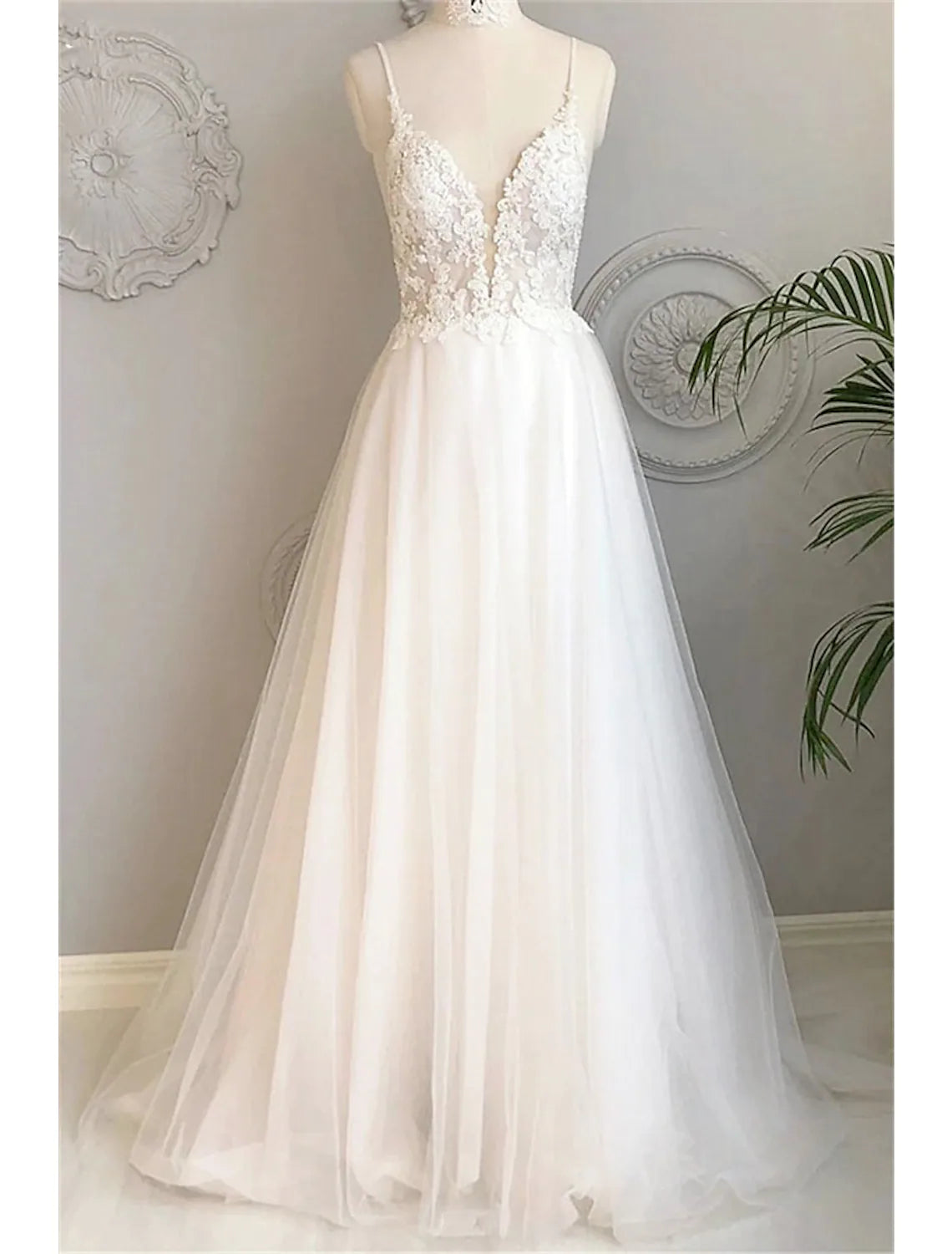Chic A-Line spaghetti strap lace beach wedding dress with court train.