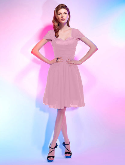 Model in a blue A-line sweetheart short sleeve chiffon homecoming dress, side view.