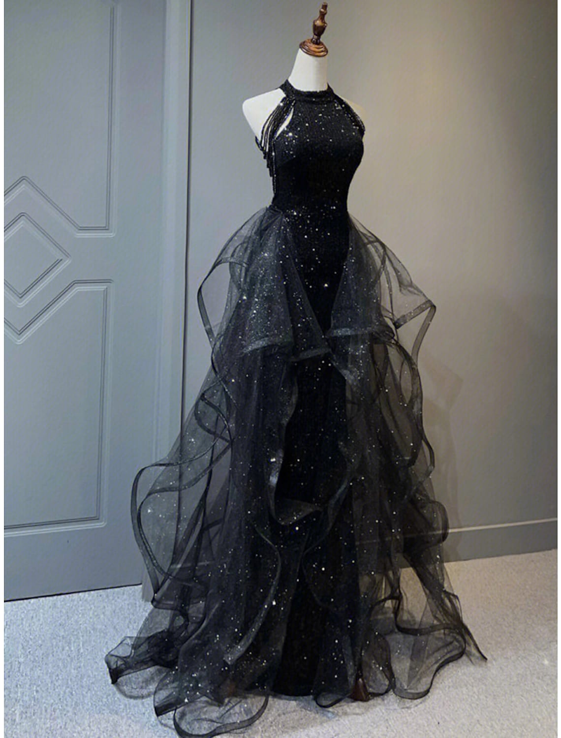 Close-up of the sequined halter neckline and crystal embellishments on the prom dress.