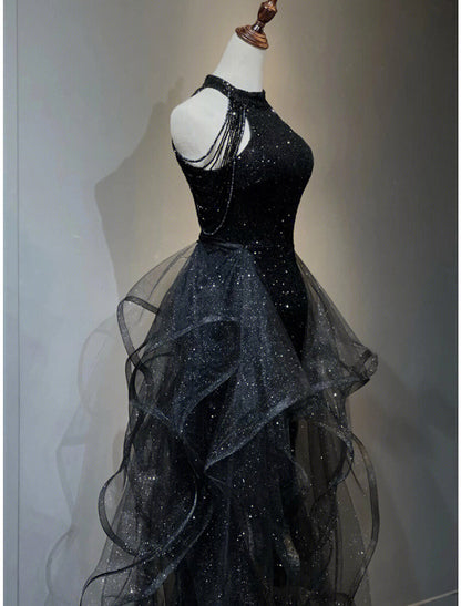 Back view of the A-line sequined prom dress, highlighting the sweep train.