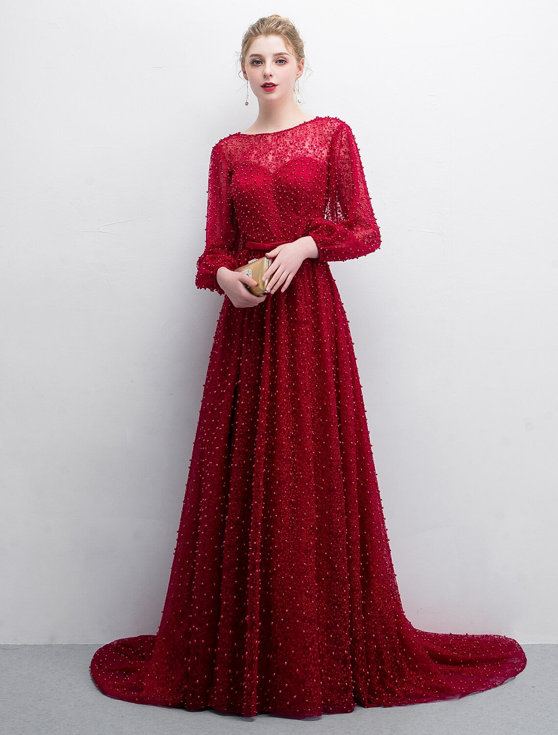 Elegant A-line boat neck long sleeve lace evening gown with sweep train.
