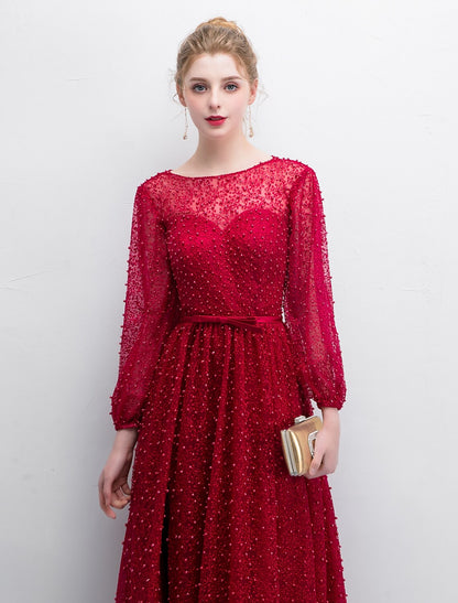 Formal A-line dress with a split front and delicate lace detailing.