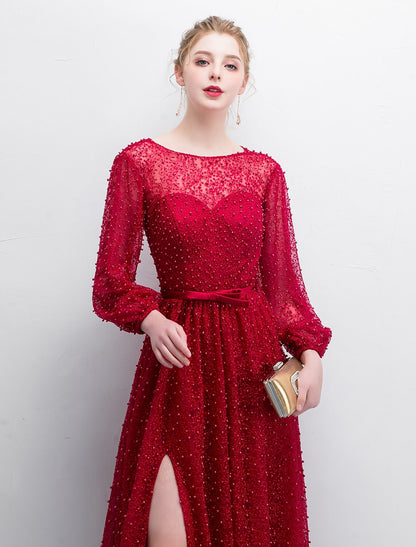 Sophisticated A-line evening gown with a sweep train and elegant boat neck.