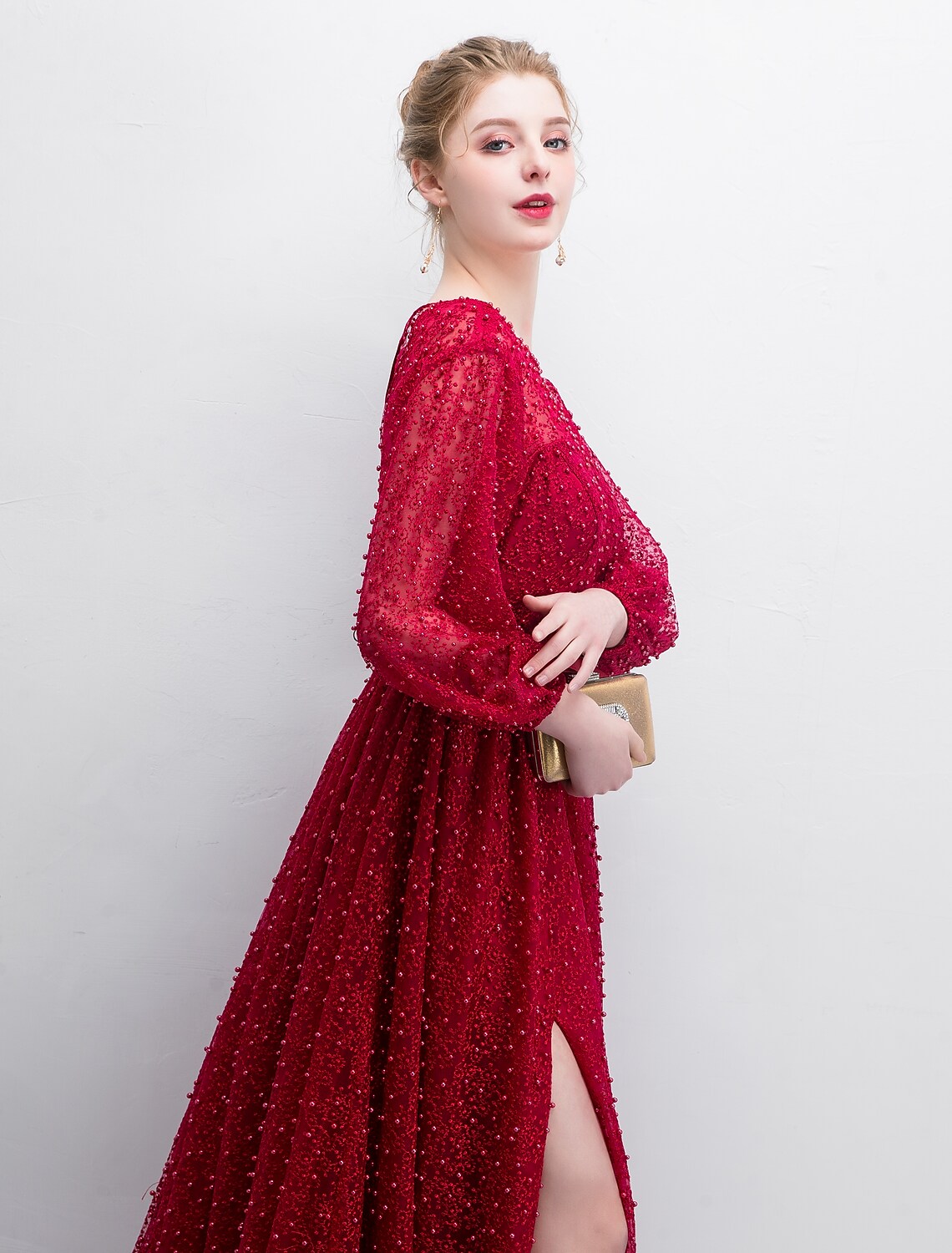 Stunning A-line long sleeve lace gown, ideal for formal occasions.