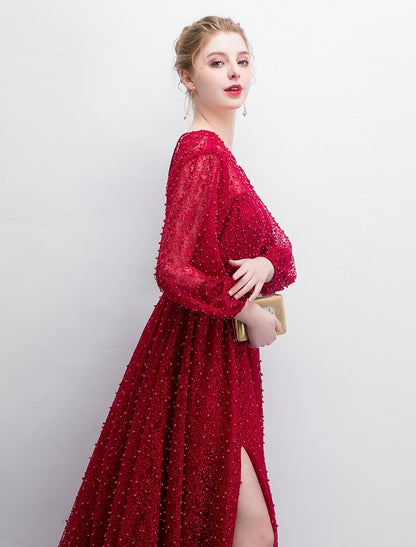 Stunning A-line long sleeve lace gown, ideal for formal occasions.