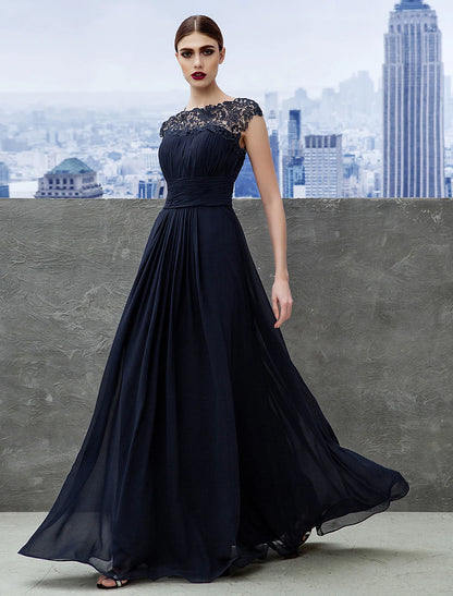 Elegant A-line empire evening gown in light blue with boat neck and short sleeves.
