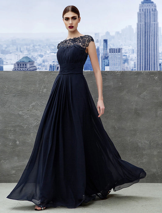 Elegant A-line empire evening gown in light blue with boat neck and short sleeves.