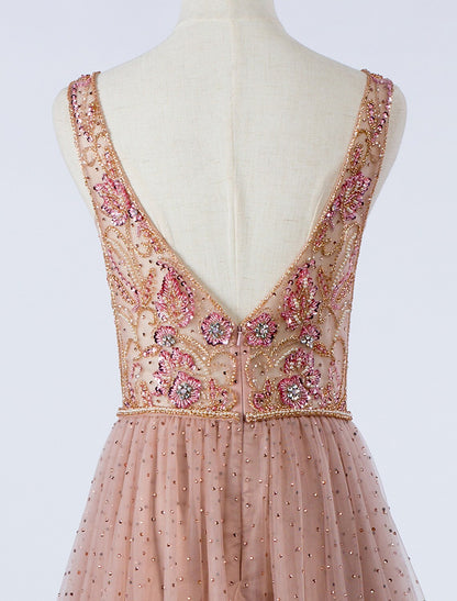 Side view of the flowing tulle skirt on the A-Line silver formal dress.