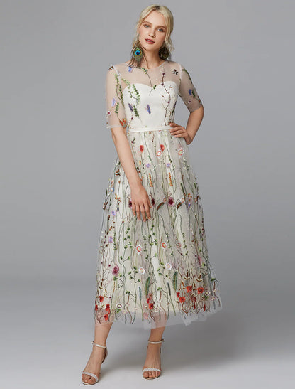 Elegant A-line white tea length dress with lace and half sleeves.