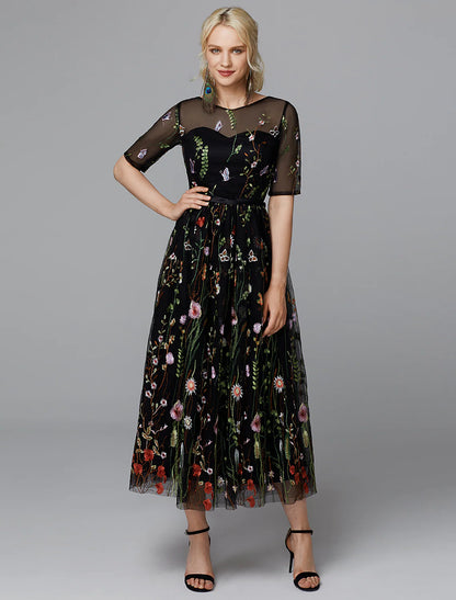 Side view of the A-line white dress showing embroidery details.
