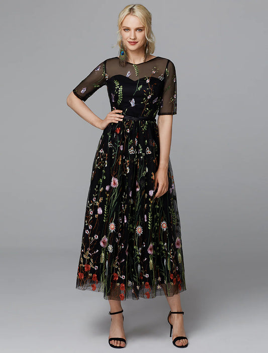 Side view of the A-line white dress showing embroidery details.