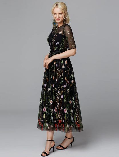 Close-up of the illusion neckline and lace embroidery on the white dress.