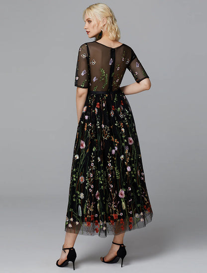 Back view of the white tea length dress with half sleeves.