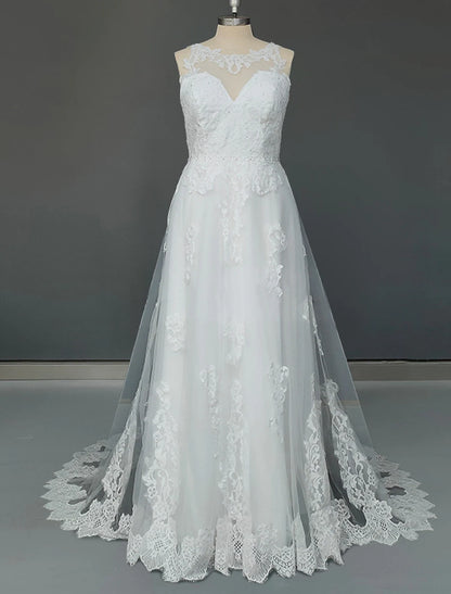 Elegant A-Line tulle wedding gown with appliques and court train.