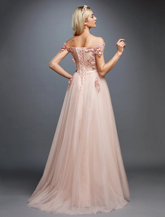 Back view of an elegant A-line off-shoulder floral applique tulle wedding guest dress with a sweep train.