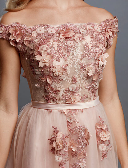Side view of an elegant A-line off-shoulder floral applique tulle wedding guest dress.
