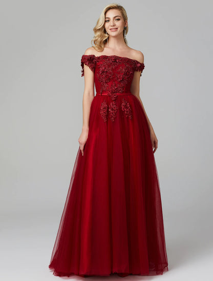 Full length view of the elegant A-line off-shoulder floral applique tulle wedding guest dress, showing movement.