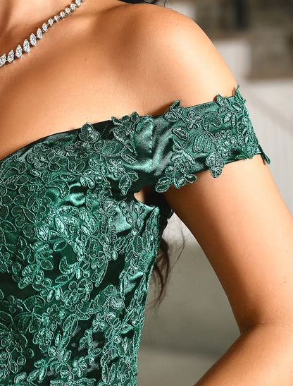 Close-up of lace appliques on the bodice of the off-shoulder prom dress.