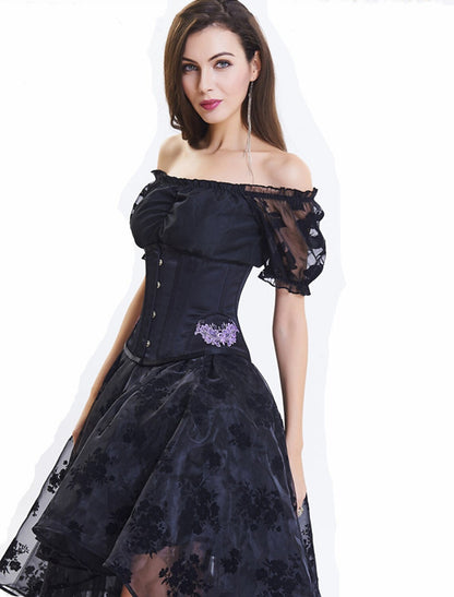 Close-up of lace and embroidery appliques on blush A-Line prom dress.