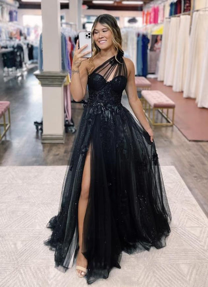 Back view of the one-shoulder prom dress, highlighting the backless design and appliques.