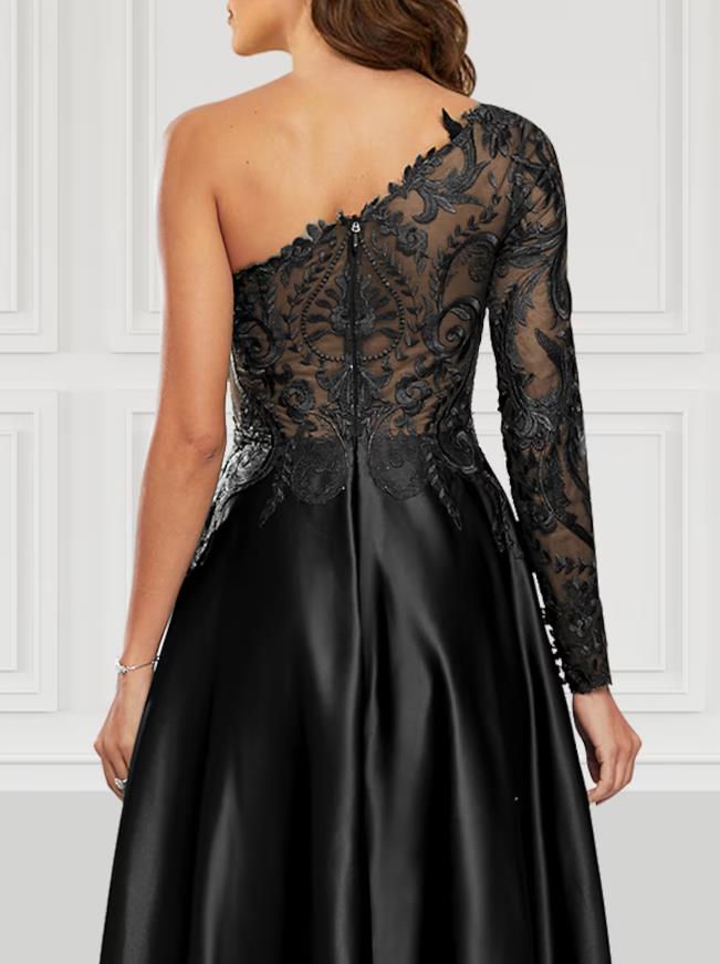 Front view of an A-line black satin prom dress, highlighting the one-shoulder design and high slit.