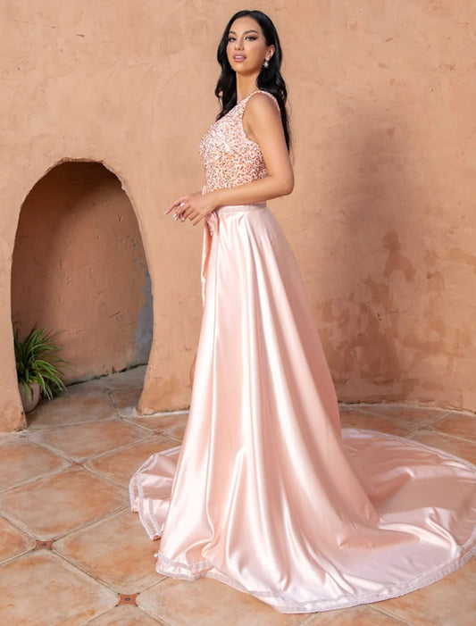 Elegant navy blue A-line one-shoulder prom gown with sequin details and a slit.